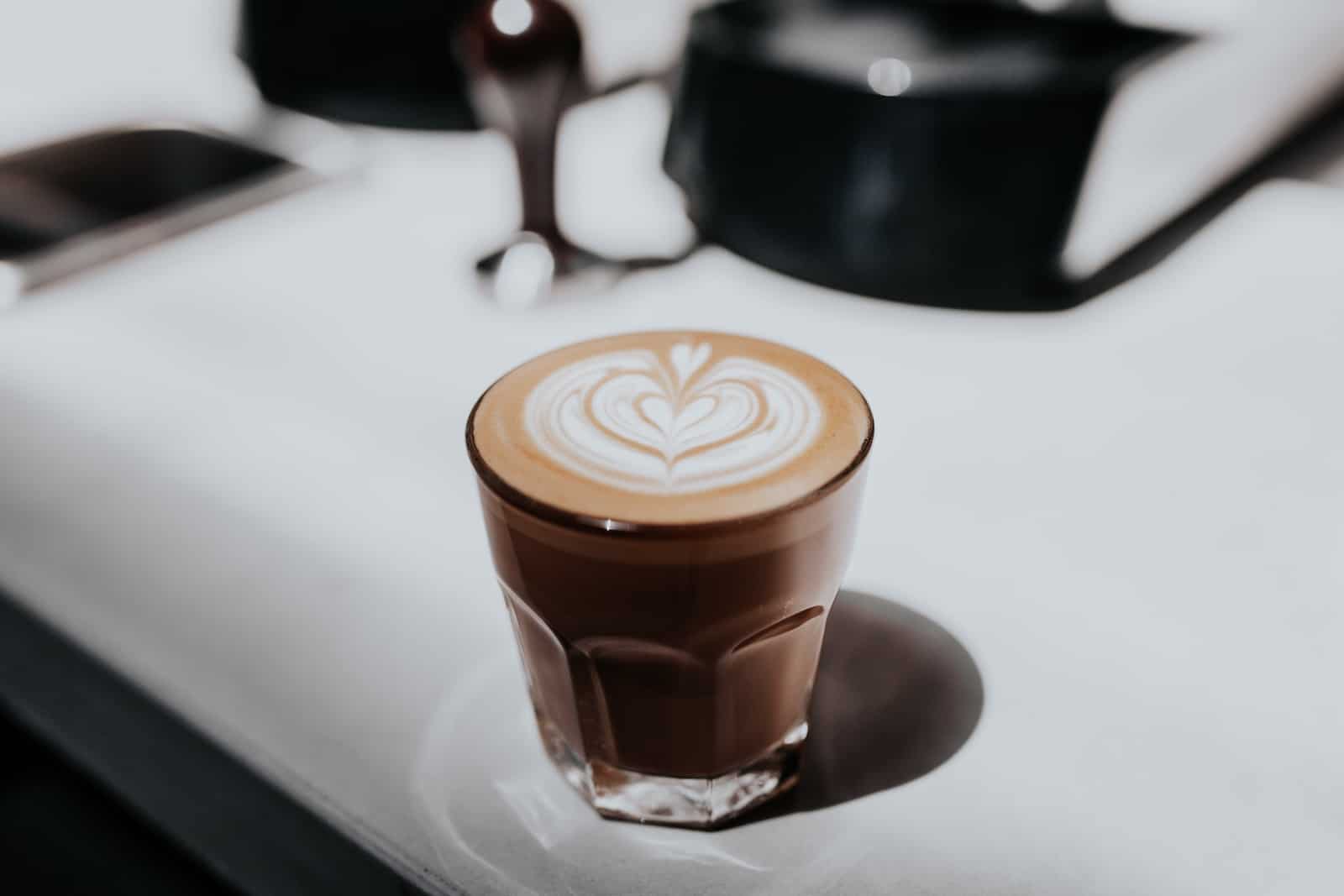 latte in a glass with latte art