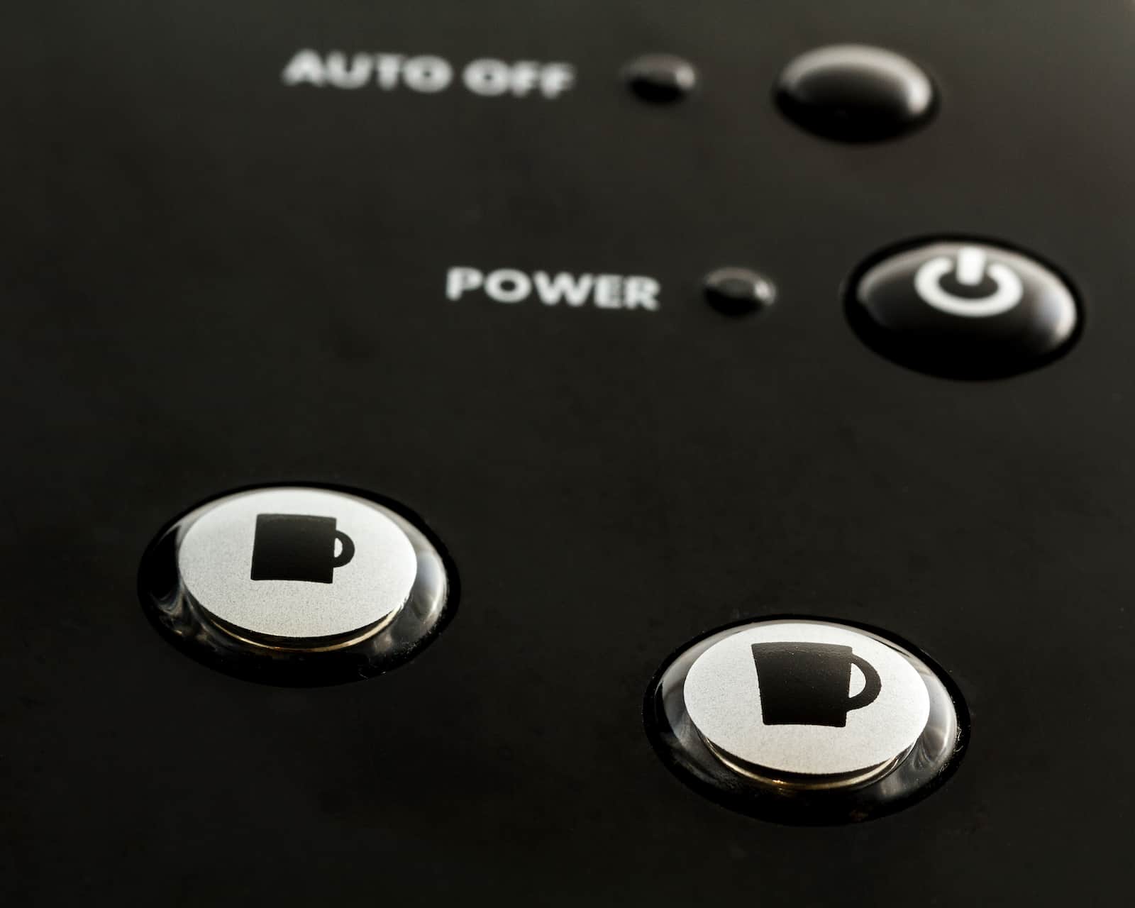 Close up of buttons on single serve coffee and tea maker.